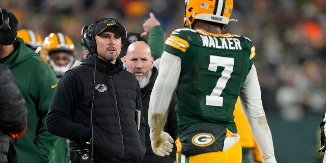 Head coach Matt LaFleur of the Packers talks with Quay Walker after he was disqualified for an unsportsmanlike penalty during the Detroit Lions game at Lambeau Field on Jan. 8, 2023, in Green Bay, Wisconsin.