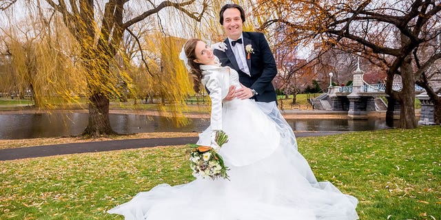 Brian and Ana Walshe pose up for a shot in Boston Public Gardens, Boston, Massachusetts on their wedding day  on Monday, December 21, 2015