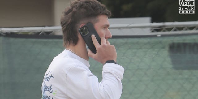 Riley Keough’s husband Ben Smith-Petersen is seen on the phone outside the West Hills Hospital and Medical Center, Thursday, January 12, 2023.