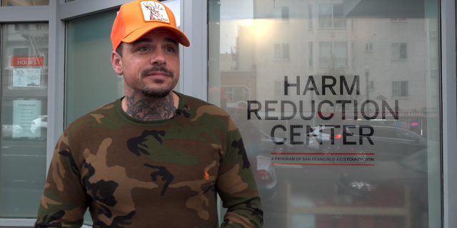 Ricci Wynne, an ex-convict accused of trafficking cocaine, stands in front of one of San Francisco's harm reduction centers.