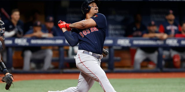 Rafael Devers of the Boston Red Sox watches his RBI single against the Tampa Bay Rays during a game Sept. 5, 2022, in St. Petersburg, Fla. The Sox have agreed to a one-year contract with the two-time All-Star that avoided salary arbitration.