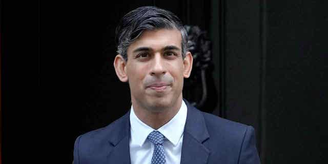 Britain's Prime Minister Rishi Sunak leaves 10 Downing Street to attend the weekly session of Prime Ministers Questions in Parliament in London, Wednesday, Jan. 11, 2023. (AP Photo/Kirsty Wigglesworth)
