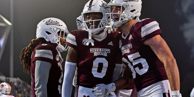Rodarius Thomas and Austin Williams of the Mississippi State Bulldogs celebrate during the first half against the Auburn Tigers on Nov. 5, 2022, in Starkville, Mississippi.