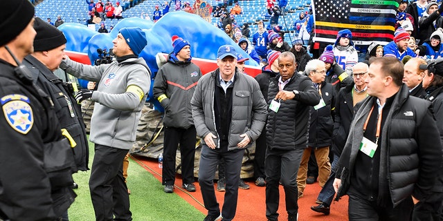 NFL Commissioner Roger Goodell, center, arrives to Highmark Stadium before game between the Buffalo Bills and the New England Patriots, Sunday, Jan. 8, 2023, in Orchard Park, New York.