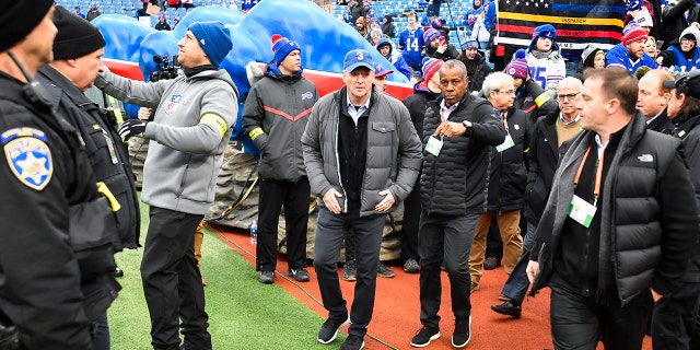 NFL Commissioner Roger Goodell, center, arrives to Highmark Stadium before game between the Buffalo Bills and the New England Patriots, Sunday, Jan. 8, 2023, in Orchard Park, New York.