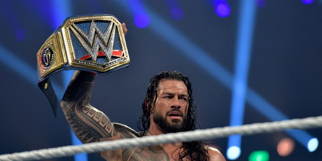 Roman Reigns celebrates after defeating Bill Goldberg during WWE Elimination Chamber 2022 at the Jeddah Superdome in the Red Sea port city of Jeddah in Saudi Arabia on February 19, 2022.