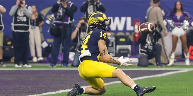 Michigan Wolverines wide receiver Roman Wilson catches a pass at the one-yard line during the VRBO Fiesta Bowl against the TCU Horned Frogs on Dec. 31, 2022, at State Farm Stadium in Glendale, Arizona.