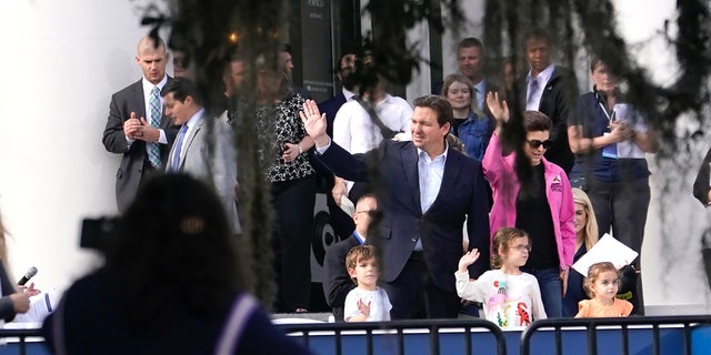 Florida Gov. Ron DeSantis, left, waves with his wife Casey and their children Mason, left, Madison, center, and Mamie, right, as he does a run through in preparation for his inauguration in Monday, Jan. 2, 2023, at the Old Capitol, in Tallahassee, Fla. DeSantis will be sworn in for his second term as Florida Governor Tuesday. (AP Photo/Lynne Sladky)
