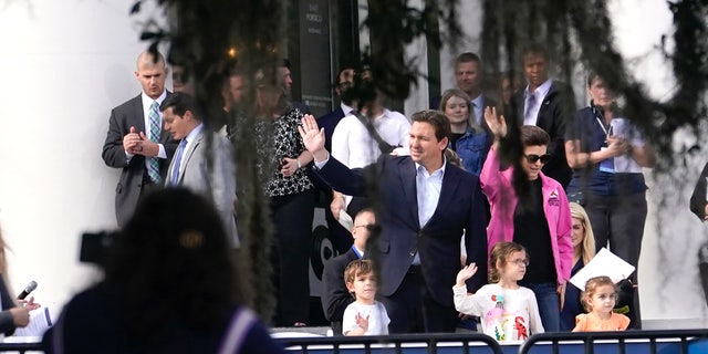 Florida Gov. Ron DeSantis, left, waves with his wife Casey and their children Mason, left, Madison, center, and Mamie, right, as he does a run through in preparation for his inauguration in Monday, Jan. 2, 2023, at the Old Capitol, in Tallahassee, Fla. DeSantis will be sworn in for his second term as Florida Governor Tuesday. (AP Photo/Lynne Sladky)