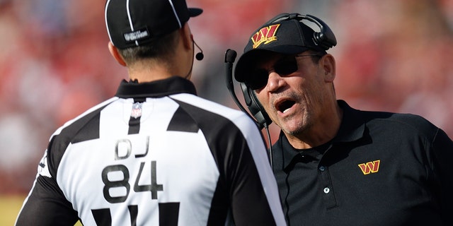 Washington Commanders head coach Ron Rivera speaks with officials during the first half of the NFL football game against the San Francisco 49ers in Santa Clara, Calif., Saturday, Dec. 24, 2022. 