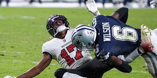 Buccaneers wide receiver Russell Gage is hit by Dallas Cowboys safety Donovan Wilson, Monday, Jan. 16, 2023, in Tampa.