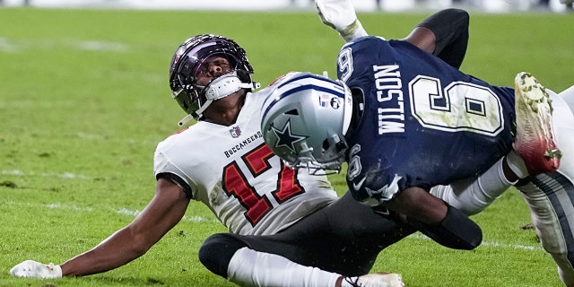 Buccaneers wide receiver Russell Gage is hit by Dallas Cowboys safety Donovan Wilson, Monday, Jan. 16, 2023, in Tampa.