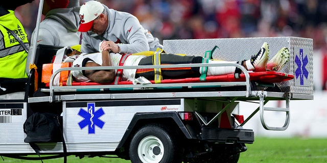 Russell Gage #17 of the Tampa Bay Buccaneers is carted off the field after suffering an injury against the Dallas Cowboys during the fourth quarter in the NFC Wild Card playoff game at Raymond James Stadium on January 16, 2023 in Tampa, Florida.