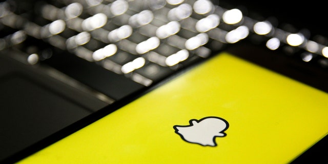 Snapchat logo on phone screen