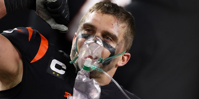 Cincinnati Bengals defensive end Sam Hubbard (94) uses oxygen after scoring 98-yard touchdown from a fumble recovery during the game against the Baltimore Ravens and the Cincinnati Bengals on January 15, 2023, at Paycor Stadium in Cincinnati, OH.