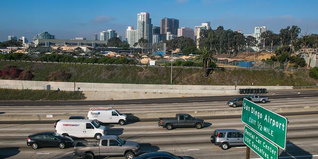 San Diego freeway with city skyline in background