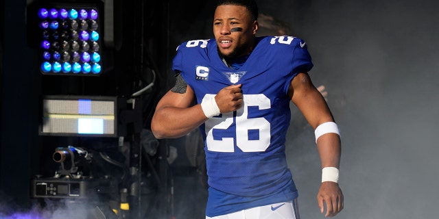 New York Giants running back Saquon Barkley reacts to being introduced before a game against the Indianapolis Colts on January 1, 2023 in East Rutherford, NJ. 