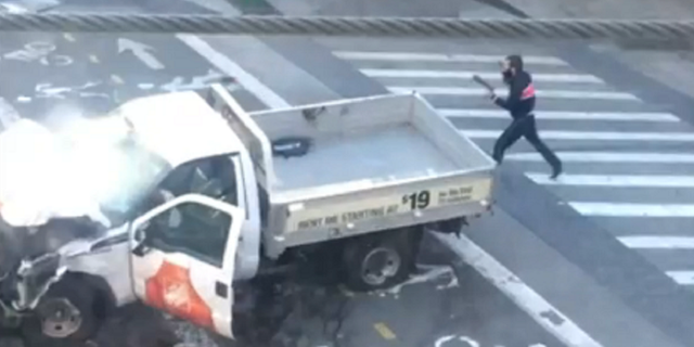 Sayfullo Saipov is seen exiting the rented truck allegedly used in the attack and is carrying what appears to be two pistols, one in each hand.