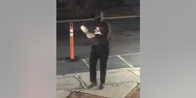 Surveillance footage shows a Caucasian male approaching the front door, lighting the Molotov cocktail, and then throwing it at the front door.