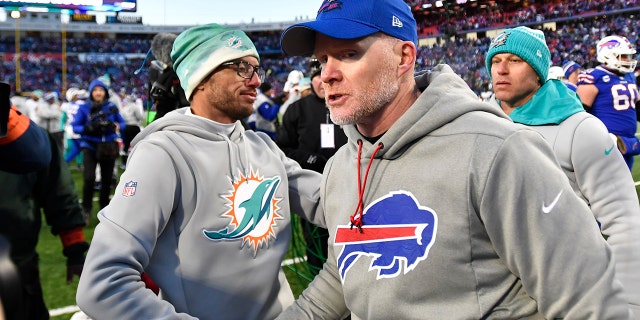 Buffalo Bills head coach Sean McDermott, right, greets Miami Dolphins head coach Mike McDaniel after an NFL wild-card playoff football game, Sunday, Jan. 15, 2023, in Orchard Park, N.Y.