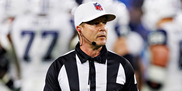 Referee Shawn Hochuli on the field during a game between the Dallas Cowboys and the Tennessee Titans at Nissan Stadium on Dec. 29, 2022, in Nashville.
