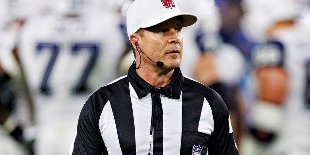 Referee Shawn Hochuli on the field during a game between the Dallas Cowboys and the Tennessee Titans at Nissan Stadium on Dec. 29, 2022, in Nashville.