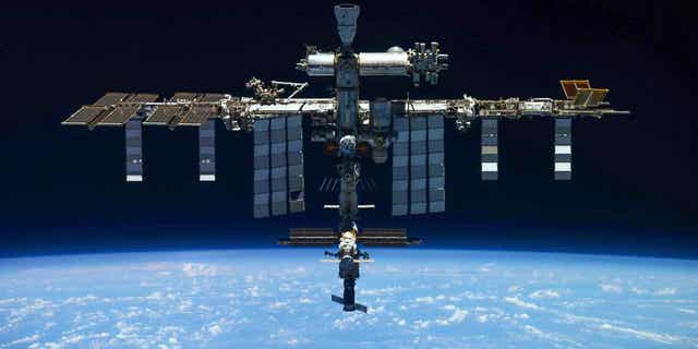 In this handout photo released by Roscosmos State Space Corporation, a view of the International Space Station taken on March 30, 2022, by the crew of Russia's Soyuz MS-19 spacecraft after undocking from the station. 