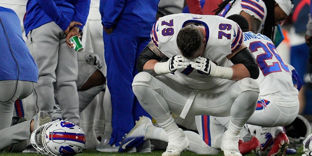 Buffalo Bills' Spencer Brown (79) reacts as teammate Damar Hamlin is examined during the first half of an NFL football game against the Cincinnati Bengals, Monday, Jan. 2, 2023, in Cincinnati. 