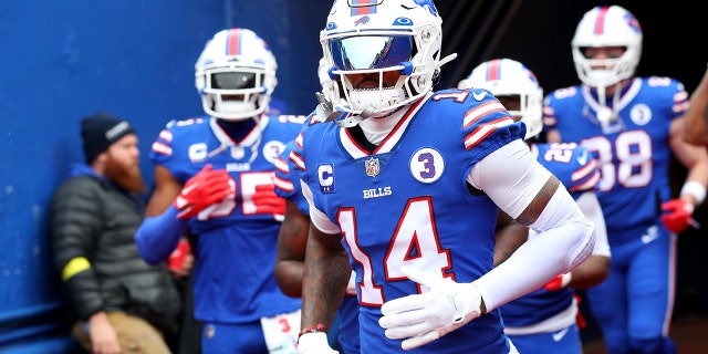 Stefon Diggs, number 14 of the Buffalo Bills, runs onto the field before a game against the New England Patriots at Highmark Stadium on January 8, 2023 in Orchard Park, New York.