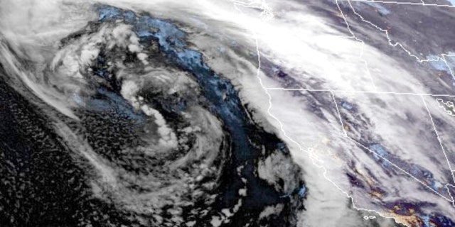 This GOES-West GeoColor satellite image made available by NOAA shows a storm system approaching along U.S. West coast at 9:16 p.m. EST, on Wednesday, Jan. 4, 2023. As a huge storm approached California on Wednesday, officials began ordering evacuations in a high-risk coastal area where mudslides killed 23 people in 2018, while residents elsewhere in the state scrambled to find sandbags, and braced themselves for flooding and power outages.