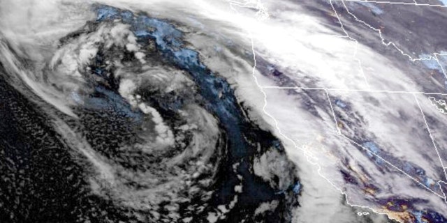 This GOES-West GeoColor satellite image made available by NOAA shows a storm system approaching along U.S. West coast at 9:16 p.m. ET, on Wednesday, Jan. 4, 2023.