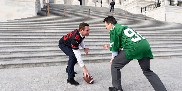 Niners fan Rep. Eric Swalwell, D-Calif., left, and Eagles fan Rep. Brendan Boyle, D-Pa., film a video outside the U.S. Capitol, Jan. 27, 2023, in advance of the San Francisco 49ers-Philadelphia Eagles NFC Championship Game on Jan. 29.