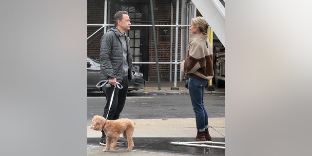 Amy Robach gave the family dog, Brody to her husband Andrew Shue. The two expressed concern during the exchange.