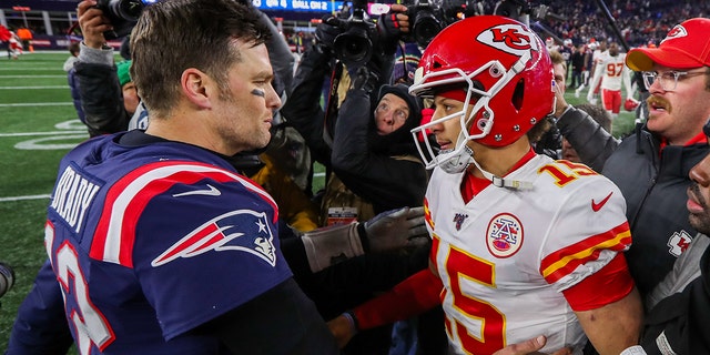 New England Patriots quarterback Tom Brady and Kansas City Chiefs quarterback Patrick Mahomes after their game at Gillette Stadium in Foxborough, Massachusetts on December 8, 2019.