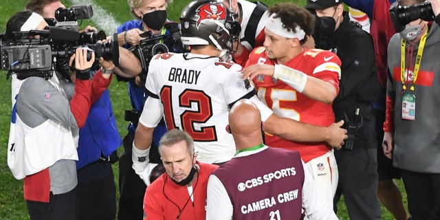 Buccaneers quarterback Tom Brady greets Kansas City Chiefs quarterback Patrick Mahomes after Super Bowl LV at Raymond James Stadium in Tampa, Florida, on Feb. 7, 2021.