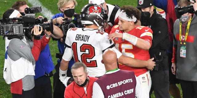 Buccaneers quarterback Tom Brady greets Kansas City Chiefs quarterback Patrick Mahomes after Super Bowl LV at Raymond James Stadium in Tampa, Florida, on Feb. 7, 2021.