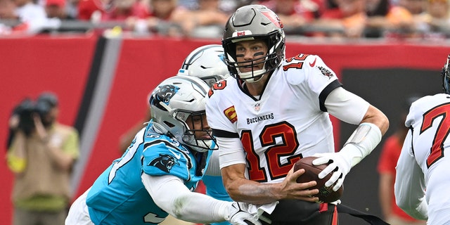 Buccaneers quarterback Tom Brady is sacked by Carolina Panthers defensive end Yetur Gross-Matos on Sunday, Jan. 1, 2023, in Tampa.