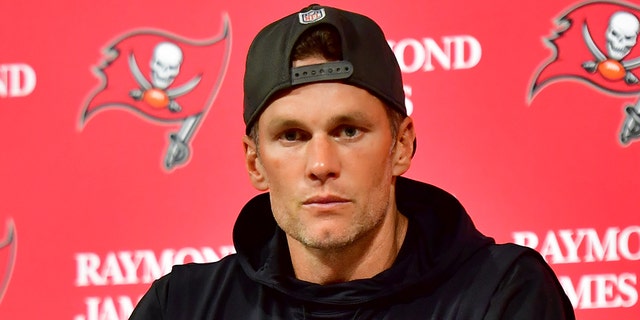 Tom Brady #12 of the Tampa Bay Buccaneers speaks to the media after losing to the Dallas Cowboys 31-14 in the NFC Wild Card playoff game at Raymond James Stadium on January 16, 2023 in Tampa, Florida.