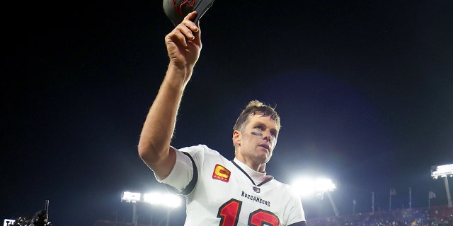 Tom Brady #12 of the Tampa Bay Buccaneers walks off the field after losing to the Dallas Cowboys 31-14 in the NFC Wild Card playoff game at Raymond James Stadium on January 16, 2023 in Tampa, Florida.