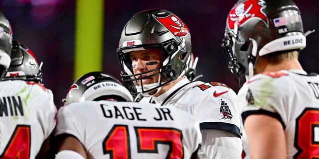 Tom Brady #12 of the Tampa Bay Buccaneers looks on in the huddle against the Dallas Cowboys during the second half in the NFC Wild Card playoff game at Raymond James Stadium on January 16, 2023 in Tampa, Florida.