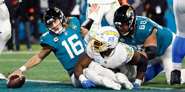 Trevor Lawrence of the Jaguars dives for a two point conversion against the Los Angeles Chargers in the AFC wild-card playoff game at TIAA Bank Field on Jan. 14, 2023, in Jacksonville.