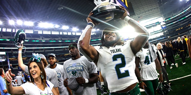 Dorian Williams #2 of the Tulane Green Wave celebrates the teams victory over the USC Trojans in the Goodyear Cotton Bowl Classic on January 2, 2023 at AT&T Stadium in Arlington, Texas.