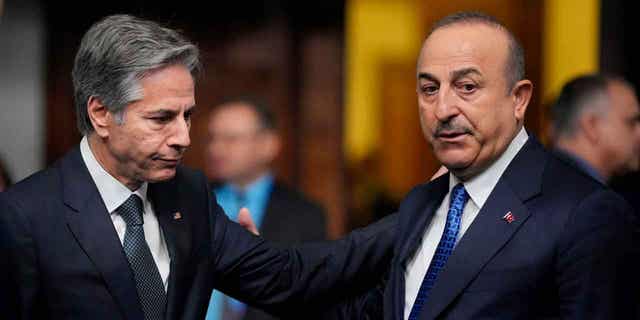 Turkey's Foreign Minister Mevlut Cavusoglu, right, plans to visit the United States this week. Cavusoglu will meet with White House officials in an attempt to smooth over issues the two countries may have.