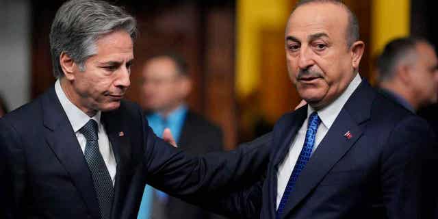 Turkey's Foreign Minister Mevlut Cavusoglu, right, plans to visit the United States this week. Cavusoglu will meet with White House officials in an attempt to smooth over issues the two countries may have.