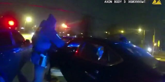 A Memphis police officer pulling Tyre Nichols out of his vehicle on Jan. 7, 2023.