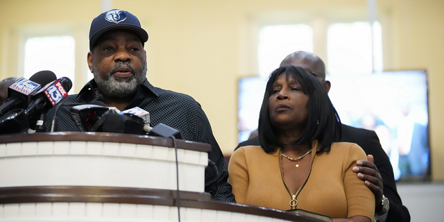 Rodney Wells, stepfather of Tyre Nichols, left, speaks at a news conference with civil rights Attorney Ben Crump, seen comforting Tyre's mother RowVaughn Wells, right, in Memphis, Tennessee, Friday, Jan. 27.