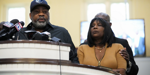 Rodney Wells, stepfather of Tyre Nichols, left, speaks at a news conference with civil rights Attorney Ben Crump, seen comforting Tyre's mother RowVaughn Wells, right, in Memphis, Tennessee, Friday, Jan. 27.