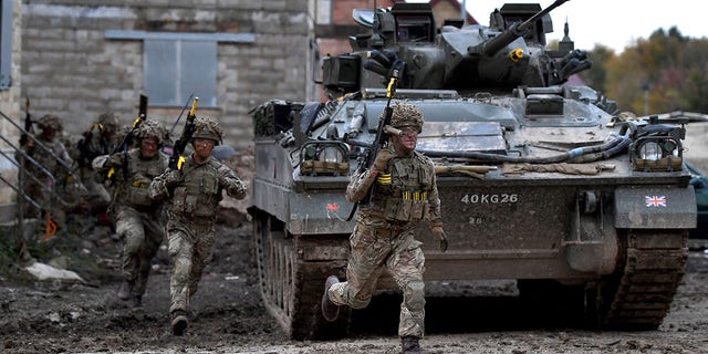 FILE: Soldiers in action as the British Army demonstrate the latest and future technology used on operations across the globe on Salisbury plain training area on October 29, 2019, in Salisbury, England. 