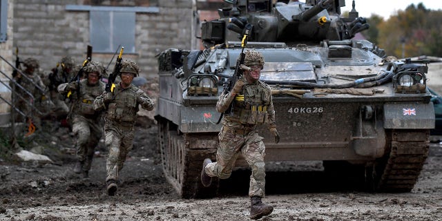 FILE: Soldiers in action as the British Army demonstrate the latest and future technology used on operations across the globe on Salisbury plain training area on October 29, 2019, in Salisbury, England. 