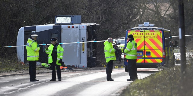 Police attend the scene of a bus crash near Cannington, Britain, January 17, 2023.